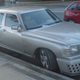 Illustration for article titled Four door Mercedes with a terrible Bugatti Veyron body kit isnt fooling anyone